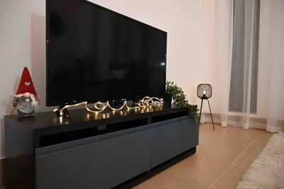 a large black entertainment center with a flat screen tv at Brand new furniture . Close to Dubai Mall. in Dubai