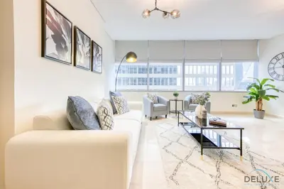 a living room with a couch and a table at Gorgeous 1BR at Sky Gardens, DIFC by Deluxe Holiday Homes in Dubai