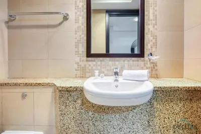 a bathroom with a sink and a mirror at Gorgeous 1BR at Sky Gardens, DIFC by Deluxe Holiday Homes in Dubai