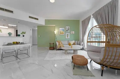 a living room with a couch and a table at Marco Polo - Your luxurious high-floor escape in Dubai Marina in Dubai