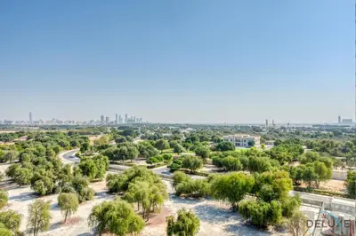 an aerial view of a park with trees and a city at Upscale Studio at Sky Gardens DIFC by Deluxe Holiday Homes in Dubai