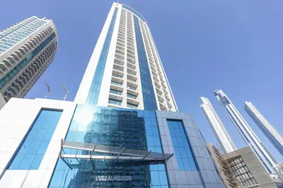 a tall building with a blue sky in the background at RH-City Retreat, 01 BR, near Burj Khalifa Downtown in Dubai