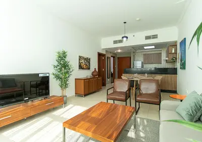 a living room with a couch and a table at RH-City Retreat, 01 BR, near Burj Khalifa Downtown in Dubai