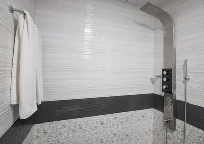 a shower with a glass door in a bathroom at Fully Furnished Studio, Ready to Move-in! Resortz 19 in Dubai