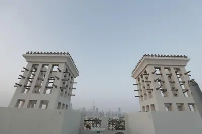 two tall white buildings sitting next to each other at Special Offer Studio for Rent in Dubai in Dubai