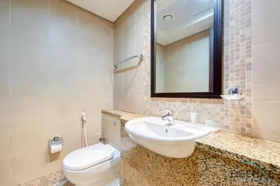 a bathroom with a sink and a toilet at Best Deal Elegant Studio with Balcony & Prime Location by Deluxe Holiday Homes in Dubai