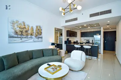 a living room with a couch and a kitchen at Luxury Escapes - Marina Views 1BR Apartments - Bay Central Dubai Marina in Dubai