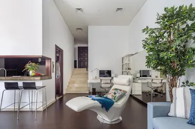a living room with a couch and a table at Frank Porter - Marina Promenade in Dubai