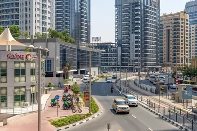 a busy city street with cars and buildings at Frank Porter - Marina Promenade in Dubai