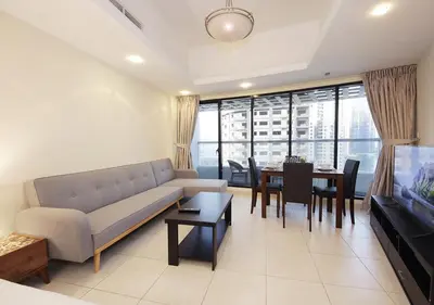 a living room with a couch and a dining room at RH- Cozy Studio, Al Waleed , Cluster R, JLT in Dubai