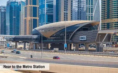 a metro station next to a highway in a city at Luxury Escapes - Spacious 2BR Apt in the heart of Dubai Marina- Yacht Bay in Dubai