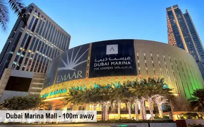 a large building in a city with tall buildings at Luxury Escapes - Spacious 2BR Apt in the heart of Dubai Marina- Yacht Bay in Dubai