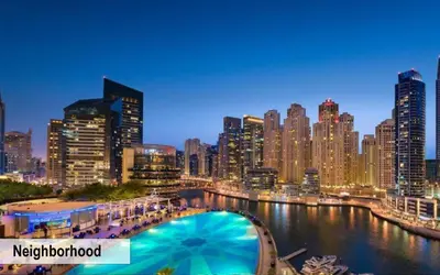 a view of a city at night with a pool at Luxury Escapes - Spacious 2BR Apt in the heart of Dubai Marina- Yacht Bay in Dubai