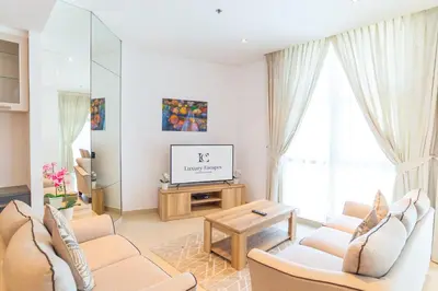 a living room with two couches and a tv at Luxury Escapes - Spacious 2BR Apt in the heart of Dubai Marina- Yacht Bay in Dubai