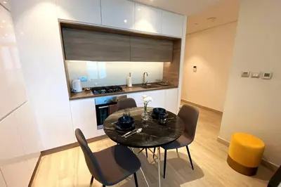 a dining room table and chairs in a kitchen at PROMO I Sea view I 1 BR apartment I Studio One Tower I Dubai Marina in Dubai