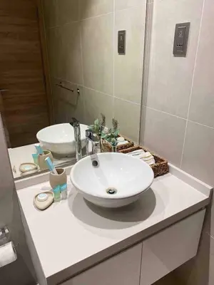 a bathroom with a white sink and a mirror at PROMO I Sea view I 1 BR apartment I Studio One Tower I Dubai Marina in Dubai