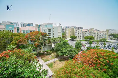 a view of a city with trees and buildings at Luxury Escapes - Tranquil Studio Near Furjan Metro - Relaxing Holiday Retreat in Dubai