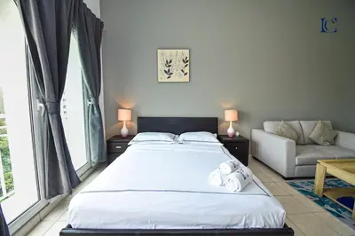 a bedroom with a large bed and a couch at Luxury Escapes - Tranquil Studio Near Furjan Metro - Relaxing Holiday Retreat in Dubai