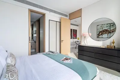 a bedroom with a large bed and a mirror at The Smart Concierge - Address JBR in Dubai