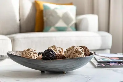 a bowl of pasta on a table with a chair at The Smart Concierge - Address JBR in Dubai