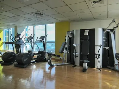 a gym with several treadmills and exercise bikes at GuestReady - Elegant 1BR w/ Balcony | Dubai Marina in Dubai
