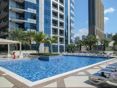 a swimming pool in the middle of a city at GuestReady - Elegant 1BR w/ Balcony | Dubai Marina in Dubai