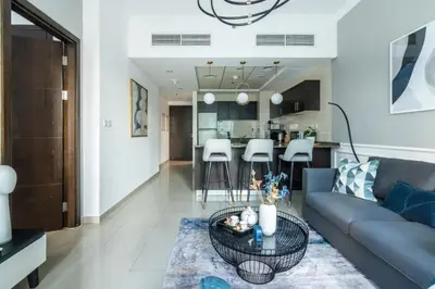 a living room with a couch and a table at GuestReady - Elegant 1BR w/ Balcony | Dubai Marina in Dubai