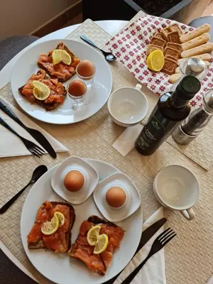 two plates of food with eggs on a table at Cherrywood House in Dubai
