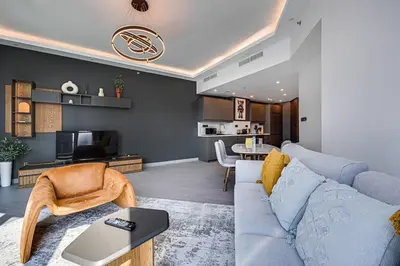 a living room with a couch and a table at The Torch, Dubai Marina in Dubai