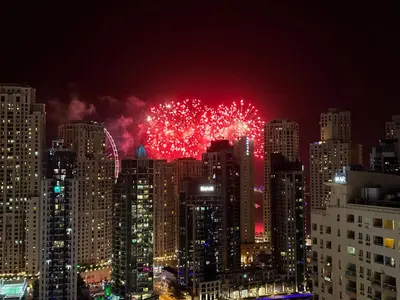 a fireworks display in a city at night at 2 BR apartment with a beautiful view of the Marina minimum 5 night in Dubai