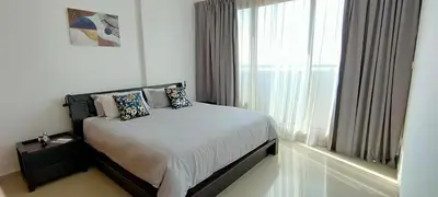 a bedroom with a bed and a large window at 2 BR apartment with a beautiful view of the Marina minimum 5 night in Dubai