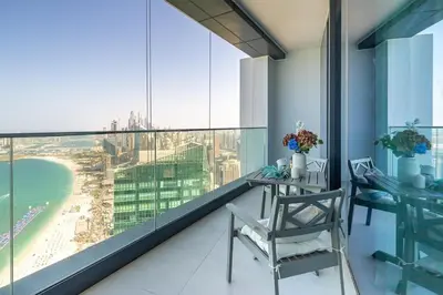 a balcony with a table and a view of the city at Frank Porter - The Address JBR in Dubai