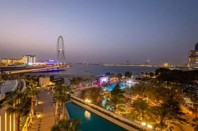 a view of a city at night with a river at Frank Porter - The Address JBR in Dubai