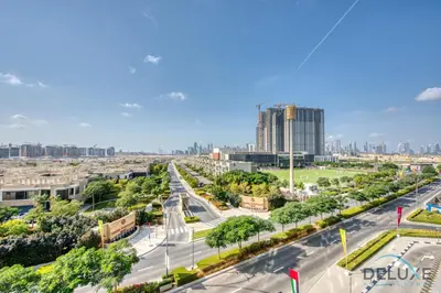 an aerial view of a city street with buildings at Notable 2BR at Sobha Hartland Greens MBR City by Deluxe Holiday Homes in Dubai