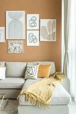 a living room with a couch with a blanket on it at GuestReady - The Ivory Coast Downtown Views in Dubai