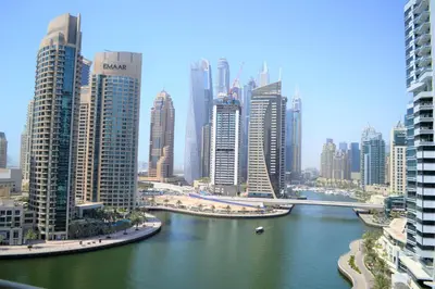 a view of a city with a river and buildings at Luxury Escapes - 1BR with Balcony & Stunning Marina View - MVT in Dubai