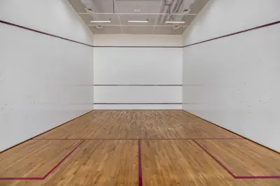 an empty room with a wooden floor and white walls at Silkhaus stunning studio in central DIFC with balcony in Dubai