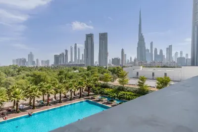 a view of the city from the rooftop of a building with a swimming pool at Silkhaus stunning studio in central DIFC with balcony in Dubai