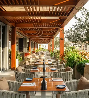 a row of tables and chairs on a patio at The Palm Tower, Nakheel Mall, Palm Jumeirah in Dubai
