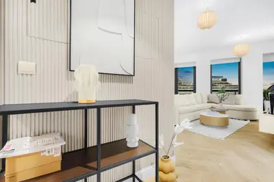 a living room with a couch and a table at Luxury 2BR with Skyline and Sea Views, Near Burj Khalifa & Dubai Mall in Dubai