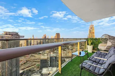 a balcony with a view of a city at Luxury 2BR with Skyline and Sea Views, Near Burj Khalifa & Dubai Mall in Dubai