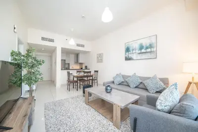 a living room with a couch and a table at Stunning 1BR with Partial Sea View in Damac Heights, Dubai Marina-21AB03 in Dubai