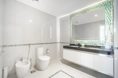 a bathroom with a toilet and a sink and a mirror at Stunning 1BR with Partial Sea View in Damac Heights, Dubai Marina-21AB03 in Dubai