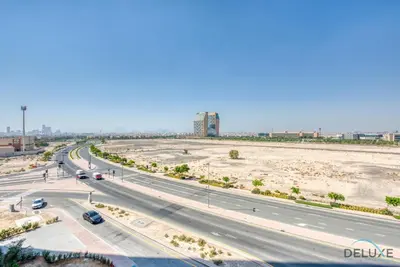an aerial view of a highway with cars on it at Whimsical 2BR at Bella Rose Barsha South by Deluxe Holiday Homes in Dubai