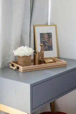 a tray with a sink and a picture on a table at Frank Porter - Yacht Bay in Dubai