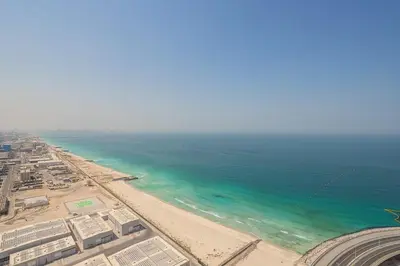 an aerial view of a beach and the ocean at Frank Porter - 5242 EMAAR Tower in Dubai