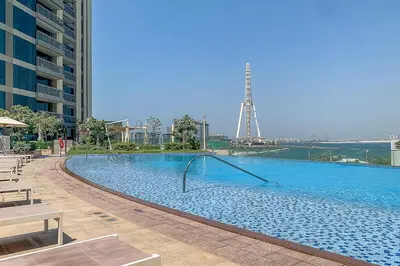 a large swimming pool in the middle of a building at Frank Porter - 5242 EMAAR Tower in Dubai