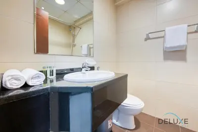 a bathroom with a sink and a toilet at Serene Studio in Elite Residences 4 Sports City by Deluxe Holiday Homes in Dubai