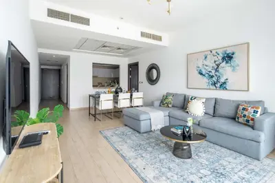 a living room with a couch and a table at Frank Porter - The Point in Dubai