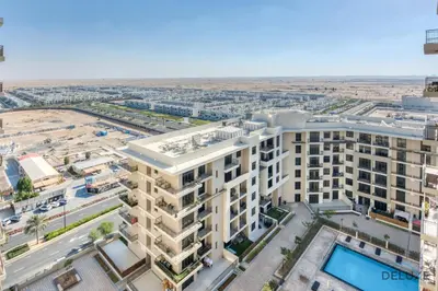 an aerial view of a large apartment building at Charming 2BR at Rawda Parkview Town Square Dubailand by Deluxe Holiday Homes in Dubai